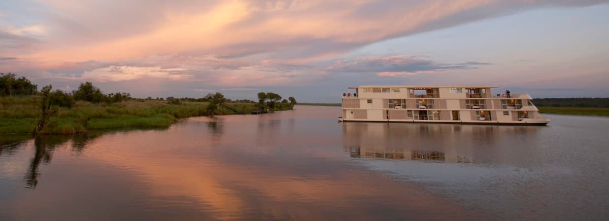 Luxury cruise ship sailing along African coastline
